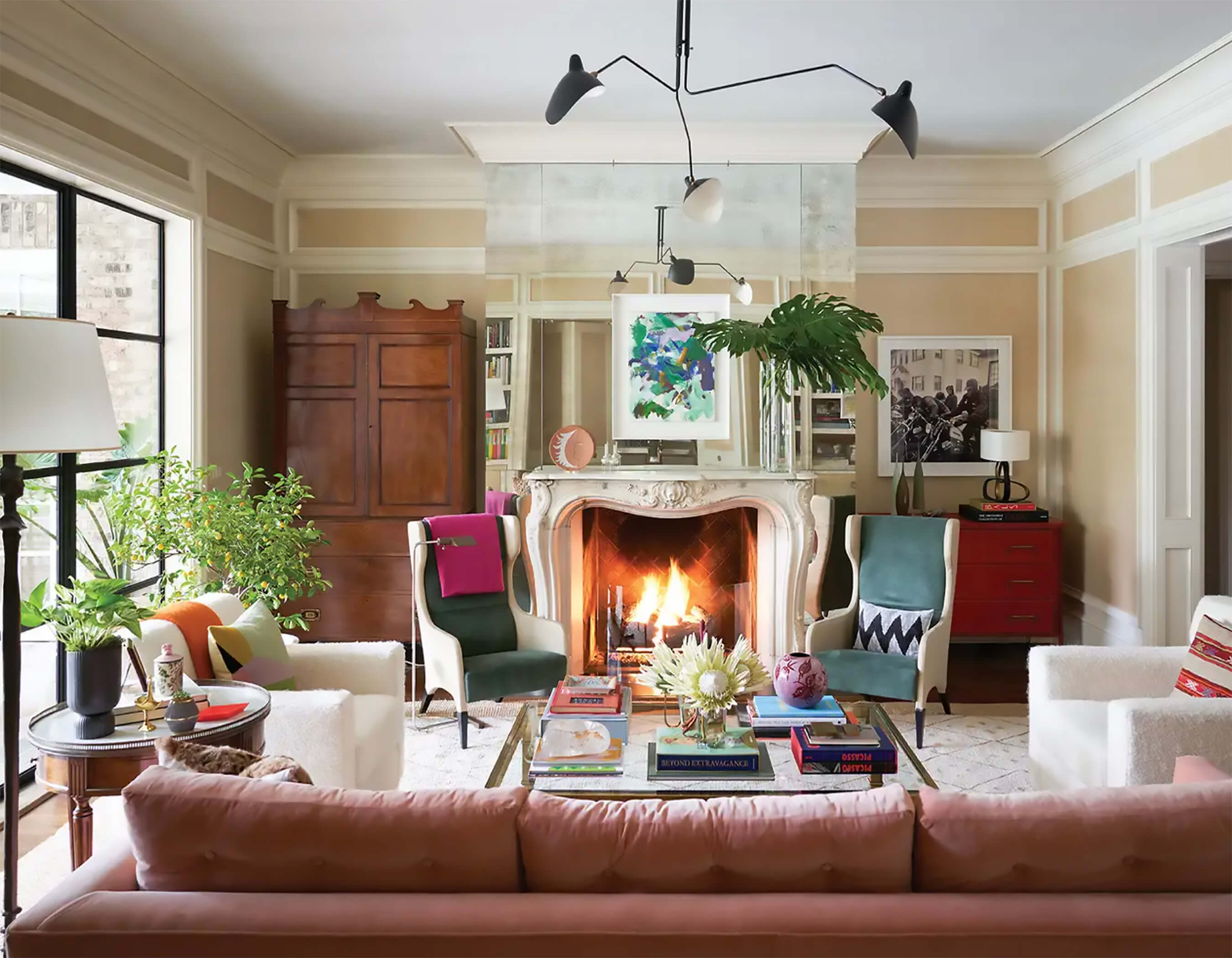 Bright maximalist living space with plants and art