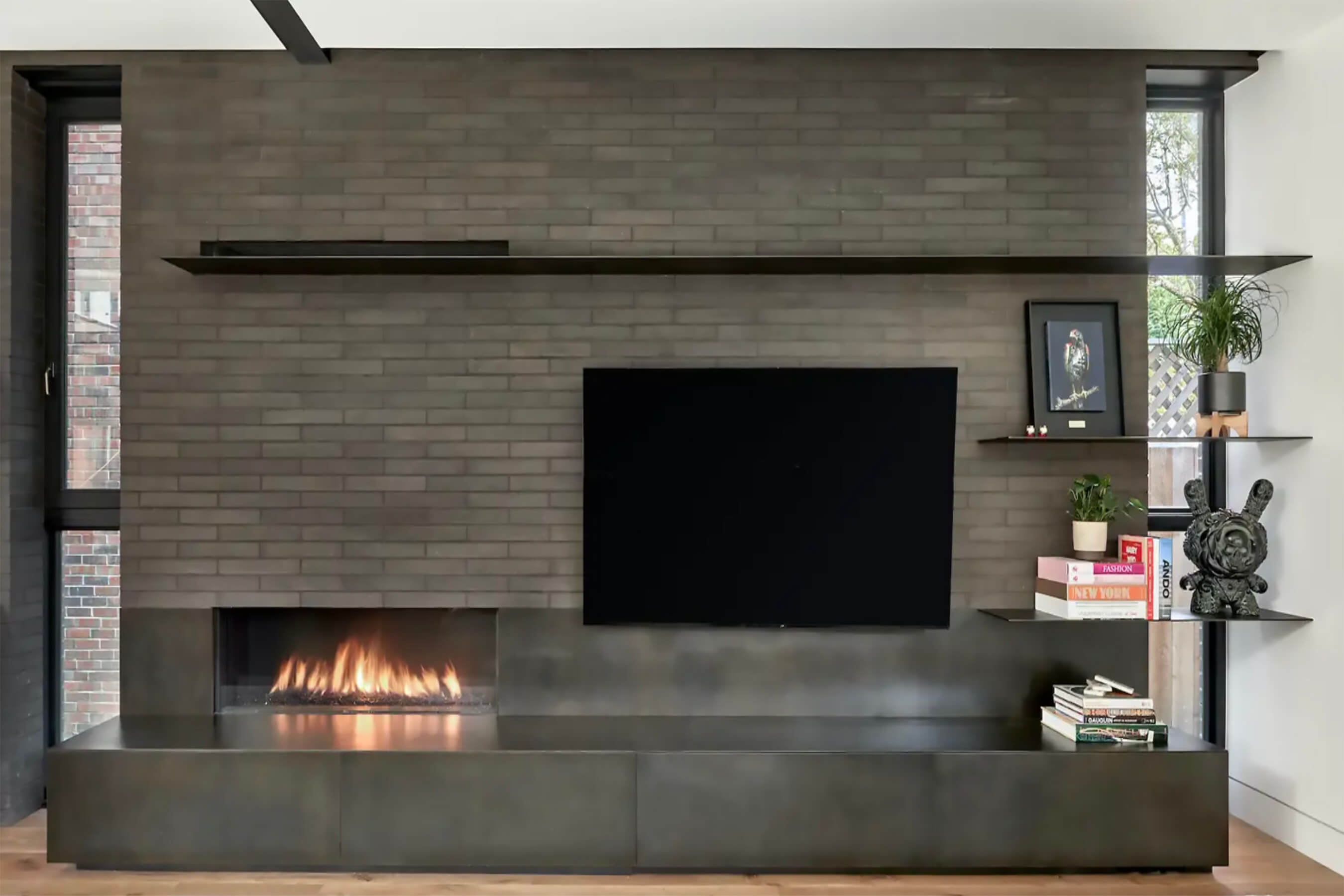 Modern media wall with sleek fireplace and decor
