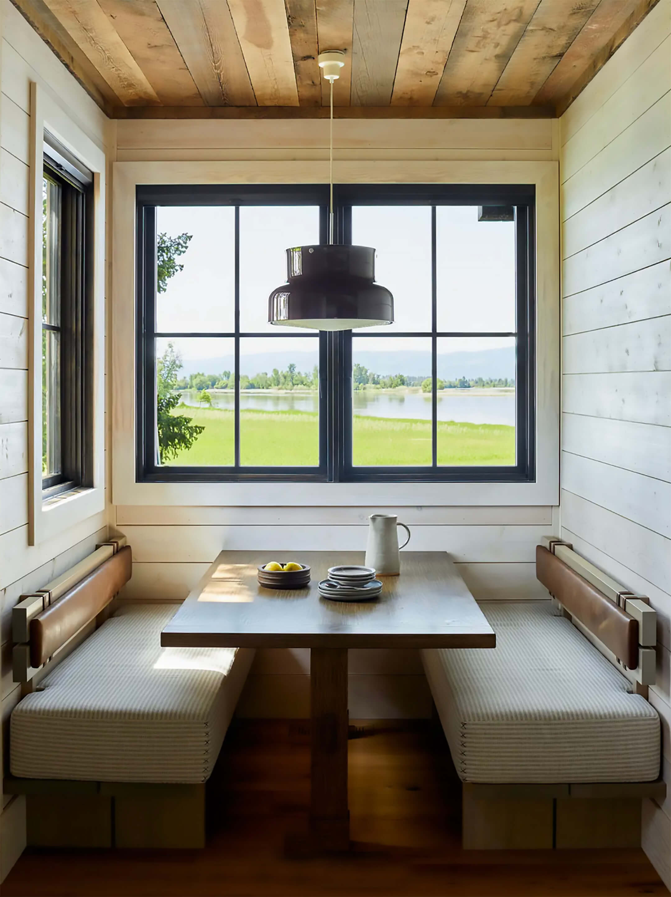 Wooden dining nook by window