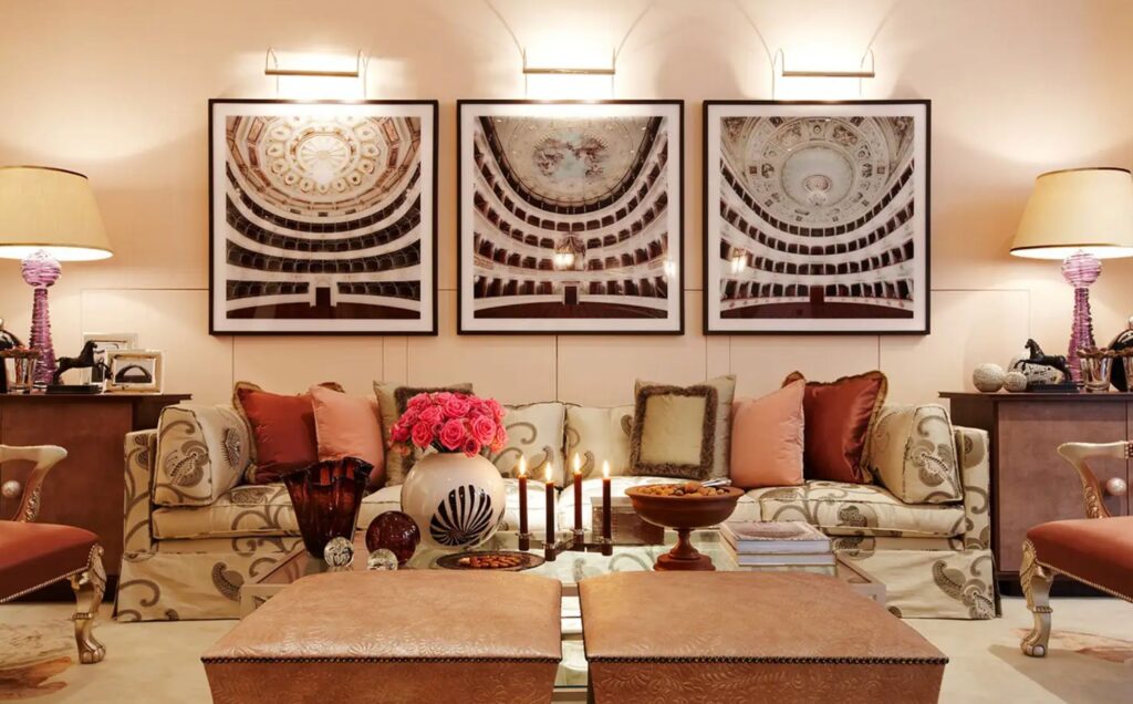 Luxurious living room with ornate furniture and theater-themed artwork